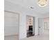 Bright bedroom featuring a walk-in closet, ensuite bathroom and contemporary lighting fixture at 3280 Soho St # 306, Orlando, FL 32835