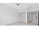 Spacious bedroom with ample closet space and a modern ceiling light fixture at 3280 Soho St # 306, Orlando, FL 32835