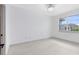 Well-lit bedroom with a window providing natural light and a modern ceiling light at 3280 Soho St # 306, Orlando, FL 32835