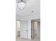A neutrally decorated interior is accented with modern lighting and black hardware at 3280 Soho St # 306, Orlando, FL 32835