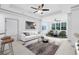 Bright living room featuring neutral decor, stylish furniture, and ample natural light at 3280 Soho St # 306, Orlando, FL 32835