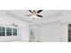 Bright living room features tray ceilings, ceiling fans and views of the backyard at 3280 Soho St # 306, Orlando, FL 32835