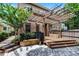 Backyard features brick pavers, a wooden deck, and a pergola that offers shade for relaxing at 336 E Kaley St, Orlando, FL 32806