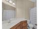 Bathroom with single sink, vanity, mirror, and shower with bathtub in the background at 336 E Kaley St, Orlando, FL 32806