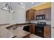 Updated kitchen with a breakfast bar, stainless steel appliances, and ample counter space at 336 E Kaley St, Orlando, FL 32806