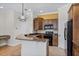 Well-equipped kitchen with granite countertops, a breakfast bar, and stainless steel appliances at 336 E Kaley St, Orlando, FL 32806