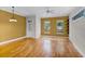 Sunlit living room with hardwood floors, crown molding, and ample natural light at 336 E Kaley St, Orlando, FL 32806