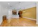 Open-concept living area with hardwood floors, kitchen island, and space for entertaining at 336 E Kaley St, Orlando, FL 32806