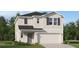 Charming two-story home with a attached two-car garage, well-maintained lawn and neutral toned siding at 3535 Kimbrough Dr, Lake Wales, FL 33859