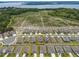 Aerial view of a suburban neighborhood with a nearby lake at 3990 Bannock Ave, Tavares, FL 32778