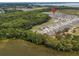 Aerial view showcasing the community near a beautiful lake and nature preserve at 3990 Bannock Ave, Tavares, FL 32778
