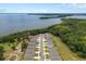 Aerial view of the neighborhood with waterfront access and lush greenery at 3990 Bannock Ave, Tavares, FL 32778