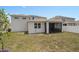 View of the backyard and screened in porch at 3990 Bannock Ave, Tavares, FL 32778