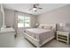 Serene bedroom featuring a large window and soft, neutral color scheme at 3990 Bannock Ave, Tavares, FL 32778