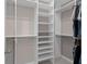 Walk-in closet featuring built-in shelving and ample storage space for organizing clothes and accessories at 3990 Bannock Ave, Tavares, FL 32778