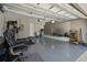 This garage has work out equipment, an epoxy floor, and room for storage and activities at 3990 Bannock Ave, Tavares, FL 32778