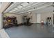 This garage has work out equipment, an epoxy floor, storage, and a work bench at 3990 Bannock Ave, Tavares, FL 32778