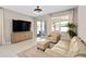 Comfortable living room with neutral tones, patio access and plenty of seating at 3990 Bannock Ave, Tavares, FL 32778