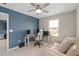 This home office features a ceiling fan, desk, white chair, and neutral colored walls at 3990 Bannock Ave, Tavares, FL 32778