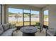 Relaxing screened porch with comfortable seating and view of the backyard at 3990 Bannock Ave, Tavares, FL 32778