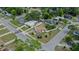 Aerial view of the property highlighting its location on a corner lot with nearby greenery and well-kept landscaping at 4420 Lake Lawne Ave, Orlando, FL 32808
