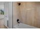 Tiled bathroom with a shower-tub combination and a modern showerhead at 4420 Lake Lawne Ave, Orlando, FL 32808