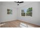 Bright bedroom with wood floor and natural light streaming through large windows at 4420 Lake Lawne Ave, Orlando, FL 32808