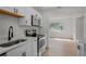 Bright kitchen with white countertops, sleek appliances and ample cabinet space at 4420 Lake Lawne Ave, Orlando, FL 32808