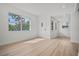 Bright living room showcasing hardwood floors and multiple windows for natural light and fresh air at 4420 Lake Lawne Ave, Orlando, FL 32808