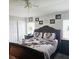 Comfortable bedroom with a large bed, ceiling fan, and closet space providing a restful retreat at 4471 Treasure Cay Rd, Tavares, FL 32778