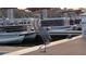 Great blue heron standing on dock with multiple boats in the background at 4471 Treasure Cay Rd, Tavares, FL 32778