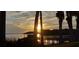 Lake view with boat dock with covered area during a sunset at 4471 Treasure Cay Rd, Tavares, FL 32778