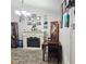 Cozy living area featuring a fireplace, neutral carpet, and stylish decor for a welcoming atmosphere at 4471 Treasure Cay Rd, Tavares, FL 32778