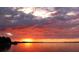 Sunset view reflecting off lake with a fiery horizon at 4471 Treasure Cay Rd, Tavares, FL 32778