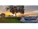 Stunning waterfront property with a private sea plane landing, dock, and picturesque sunset views at 4471 Treasure Cay Rd, Tavares, FL 32778