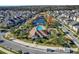Community with a pool and lake surrounded by homes and winding streets at 480 Buckhorn Dr, Winter Springs, FL 32708