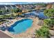 Aerial view of the community pool, surrounded by a pond and lush landscaping at 480 Buckhorn Dr, Winter Springs, FL 32708