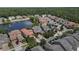 An aerial view shows the neighborhood and the beautiful community pond at 480 Buckhorn Dr, Winter Springs, FL 32708