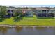 A beautiful backyard featuring a pond view and lush green lawn provides scenic outdoor living at 480 Buckhorn Dr, Winter Springs, FL 32708