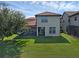Well-maintained backyard with a screened patio and lush green lawn provides ideal outdoor living space at 480 Buckhorn Dr, Winter Springs, FL 32708