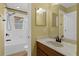 Bathroom featuring a shower-tub combo, and a vanity with a large mirror at 480 Buckhorn Dr, Winter Springs, FL 32708