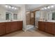 Bathroom featuring dual vanities, a glass enclosed shower, and tile flooring at 480 Buckhorn Dr, Winter Springs, FL 32708