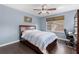 Comfortable bedroom features wood floors, light blue walls, and a ceiling fan at 480 Buckhorn Dr, Winter Springs, FL 32708