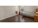 Clean bedroom with hard wood floors and a view of an en suite bathroom at 480 Buckhorn Dr, Winter Springs, FL 32708