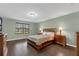 Cozy bedroom with hardwood floors, a window, and classic furnishings at 480 Buckhorn Dr, Winter Springs, FL 32708