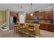 Spacious kitchen with stainless steel appliances, tile backsplash, granite counters, and a cozy breakfast bar at 480 Buckhorn Dr, Winter Springs, FL 32708