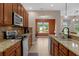 View of kitchen with granite countertops, stainless steel appliances, and breakfast bar at 480 Buckhorn Dr, Winter Springs, FL 32708