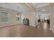 Bright and airy living room with a large window, tile flooring, and an arched doorway at 480 Buckhorn Dr, Winter Springs, FL 32708