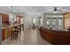 Open floorplan with view of kitchen, dining area, and living room with exterior access at 480 Buckhorn Dr, Winter Springs, FL 32708