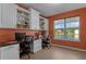 Spacious office with custom cabinets, multiple work spaces and a beautiful view at 480 Buckhorn Dr, Winter Springs, FL 32708